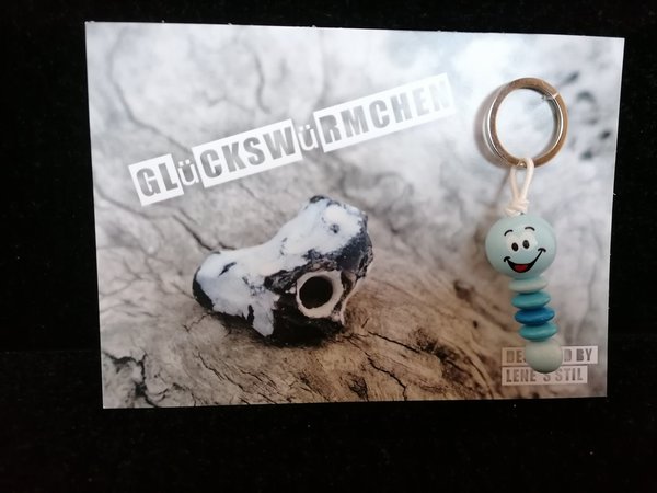 babyblaues Glückswürmchen mit Grußkarte / Schlüsselanhänger